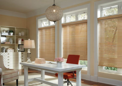 light wood blinds on large windows in home office