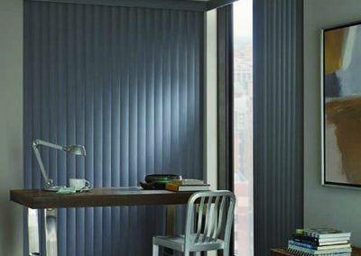 gray vertical blinds on floor to ceiling windows in home office