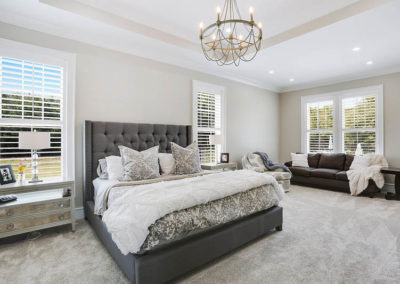 white wood shutters in bedroom with white and gray accents