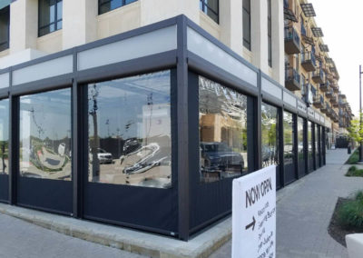 black exterior vinyl screens with windows on restaurant patio